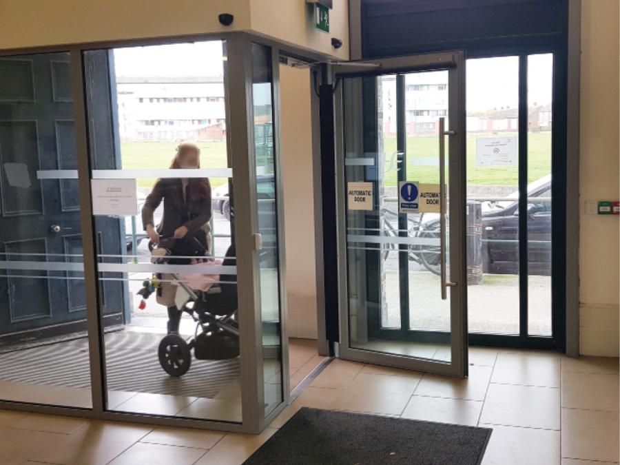 Power operated entrance door